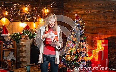 Girl enjoy cozy warm atmosphere christmas eve. Pleasant moments. Christmas joy. Woman wooden interior christmas Stock Photo