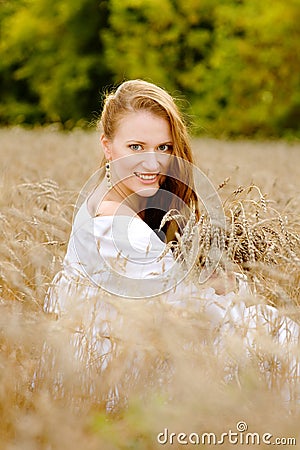 Girl enjoying life in wheat meadow Stock Photo