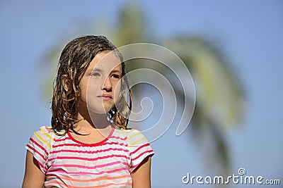 Girl enjoying the light summer rain. Stock Photo