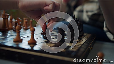 The girl explains the rules of chess. She shakes her head and tells how the pawn should move Stock Photo