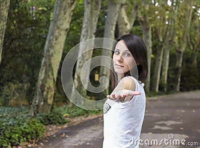 Girl with extended hand in beautiful forrest Stock Photo