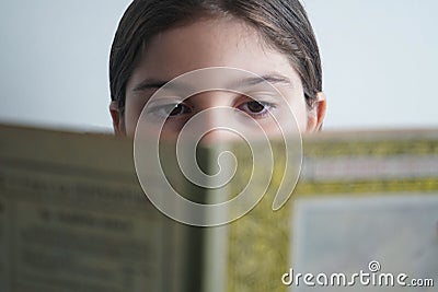 GIRL EYES LOOKING BOOK Stock Photo