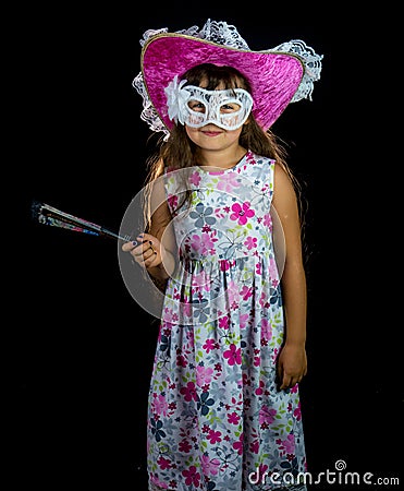 Girl with fan and mask in dress Stock Photo