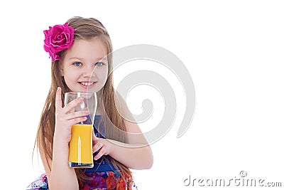 Portrait of happy little girl drinking orange juice Stock Photo