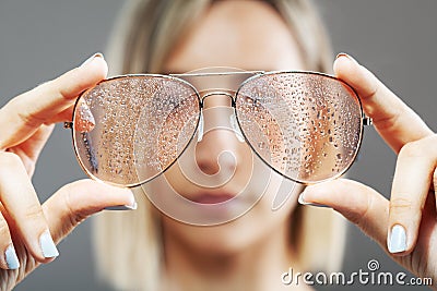 Girl with fashionable glasses. water drops visible Stock Photo