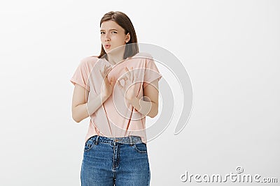 Girl feeling intense, forced to agree while standing in awkward situation, showing ok or okay gesture, making circle Stock Photo