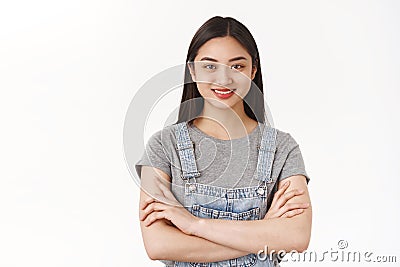 Girl feels like pro. Attractive self-assured asian woman freelance student hold arms crossed body smiling determined Stock Photo