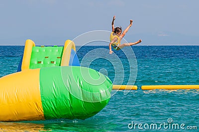 The girl flies and jumps above the sea Stock Photo