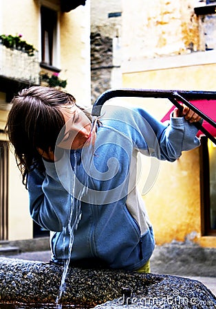 Girl at the fountain Stock Photo