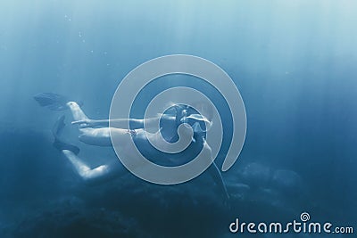 Girl free diving. Stock Photo