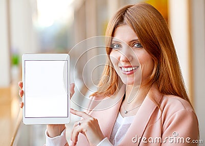 Girl freelancer holding a tablet in the office Stock Photo