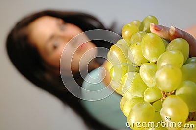 Girl with fresh grapes 1 Stock Photo