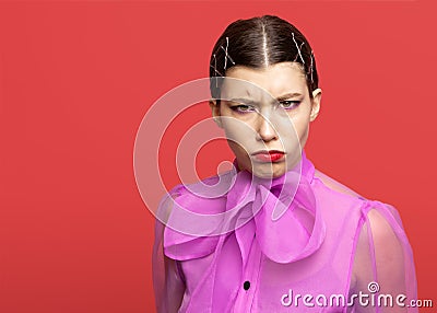 Girl frowns and expresses discontent Stock Photo