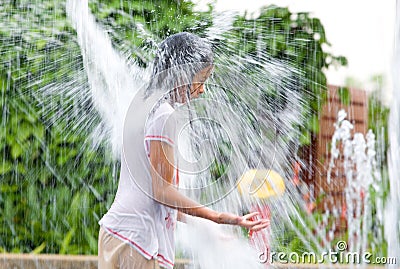 Girl getting drenched Stock Photo