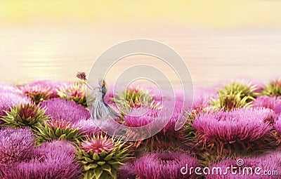 The girl is among the giant lilac flowers. Fantasy picture. Stock Photo