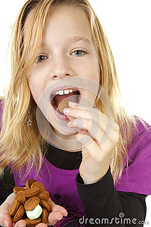 Girl with ginger nuts (pepernoten) Stock Photo