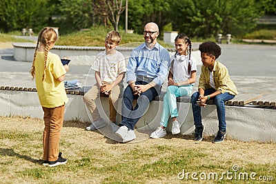 Girl Giving Presentation in Outdoor Lesson Stock Photo