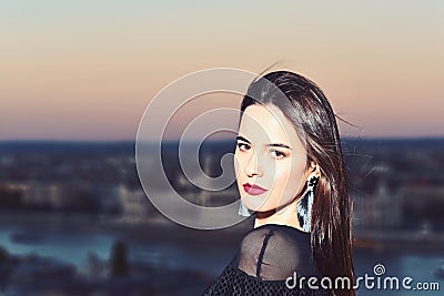 Girl with glamour makeup. Sexy girl with elegant hair. Fashion and beauty of business lady. Luxury woman with view on Stock Photo