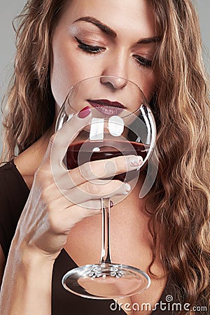 Girl with glass of red wine.Beautiful blond woman drinking red wine Stock Photo