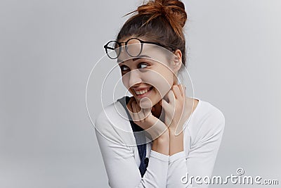 Young woman looks like she something to plan or scheming Stock Photo