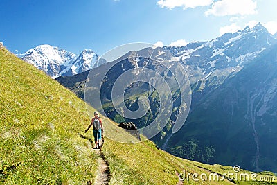 The girl goes on a mountain track Stock Photo