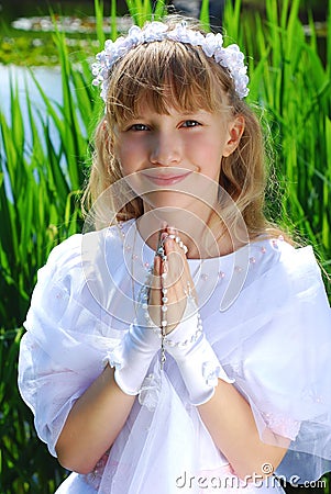 Girl going to the first holy communion Stock Photo