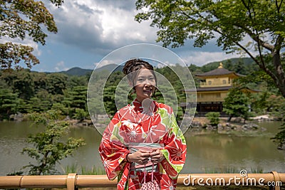 Girl at the Golden Pavilion - Kyoto, Japan Stock Photo