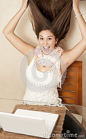 Girl gone crazy in front of laptop Stock Photo