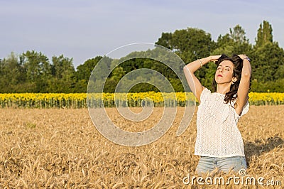 Girl at grain field Stock Photo