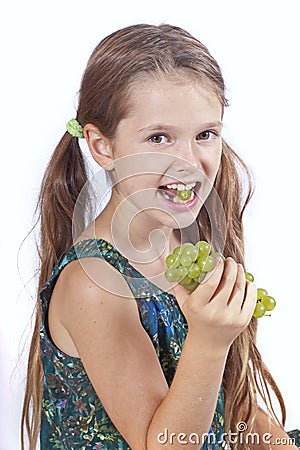 Girl with grapes Stock Photo