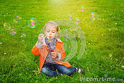 Girl grass soap bubbles Stock Photo