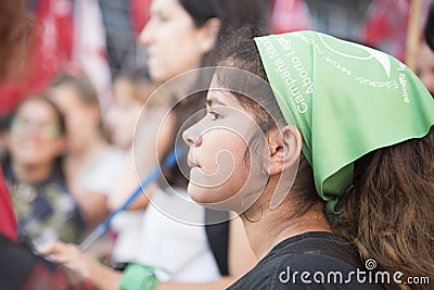 Girl with a green handkerchief, symbol of support for the law of legal abortion Editorial Stock Photo