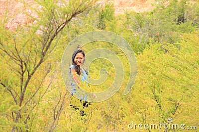Girl among green plants Stock Photo