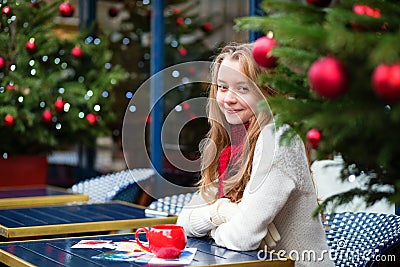 Girl with greeting cards in a Parisian cafe Stock Photo