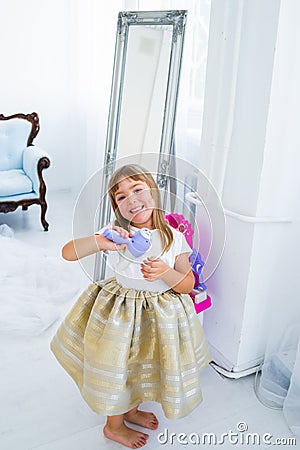 Girl with hair dryer Stock Photo