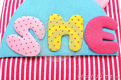 Girl hand bag with she word closeup Stock Photo