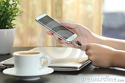 Girl hand connecting charger to smart phone Stock Photo