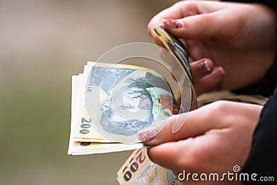 Girl hands counting money, counting Romanian LEI currency, close up Stock Photo