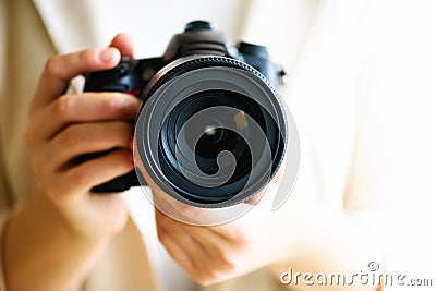 Girl hands holding photo camera, white background, copy space. Travel and shoot concept Stock Photo