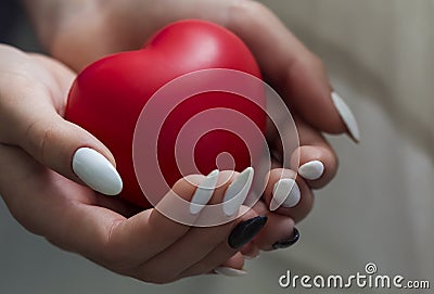 Girl hands holding red heart, health care, donate and family insurance concept,world heart day, world health day, CSR concept Stock Photo