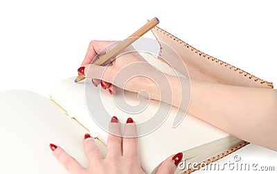 Girl hands with pencil on personal diary Stock Photo