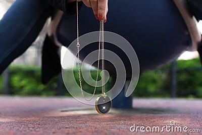 Girl hanging chakra medallion Stock Photo