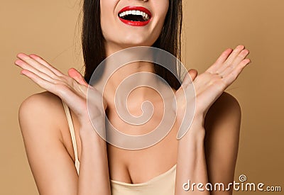 girl happily smiling happy holding hands near face Stock Photo