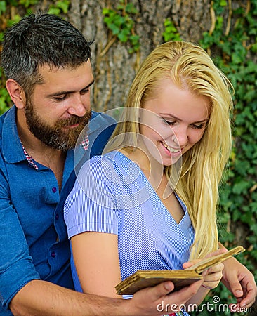 Girl with happy face holds old book. Stock Photo