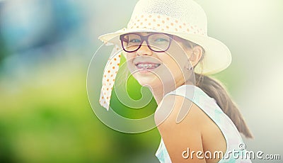 Girl.Happy girl teen pre teen. Girl with glasses. Girl with teeth braces. Young cute caucasian blond girl in summer outfit Stock Photo