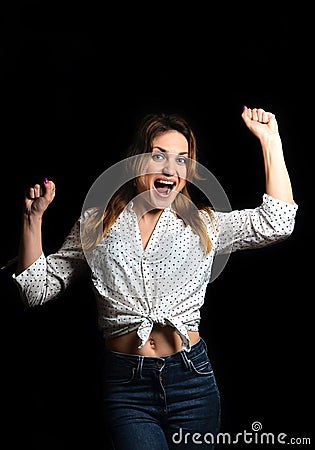 Girl is happy victory isolated on black background.We It& x27; s done Stock Photo