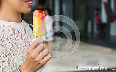 Girl having a fruit ice cream Stock Photo