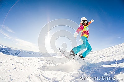 Girl having fun on her snowboard Stock Photo