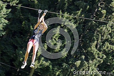 Girl having fun on a rope park adventure Stock Photo