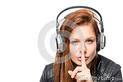 Girl in headphones asks keep quiet on a white background Stock Photo